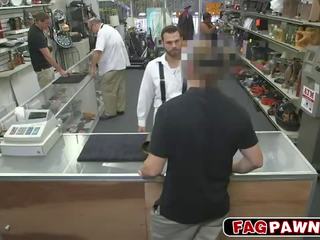 Dude blows a sik behind counter in a shop